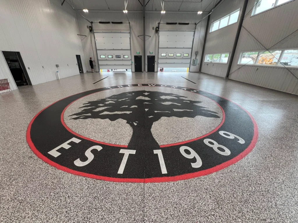 Custom Tree Works flake floor and large floor logo in Halifax