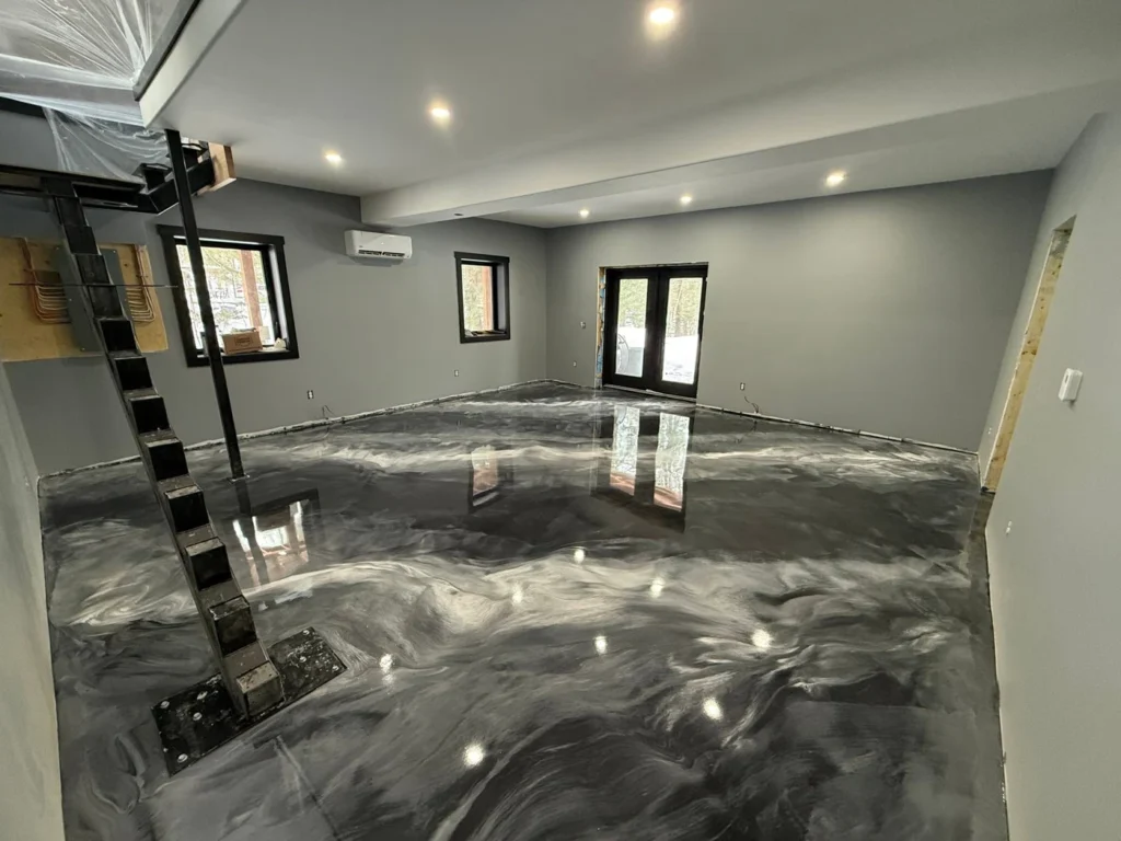 Glossy dark grey and silver metallic epoxy floor in an Annapolis Valley home interior