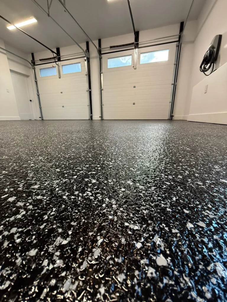 Raven garage with Domino stairs - completed floor by Top Coat Epoxy