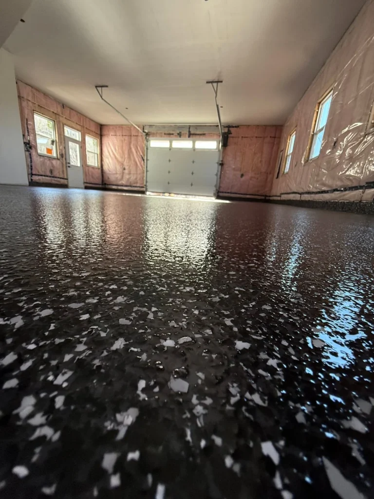 Dark Raven flake floor in a 2,000 sq ft Kingston New Brunswick garage